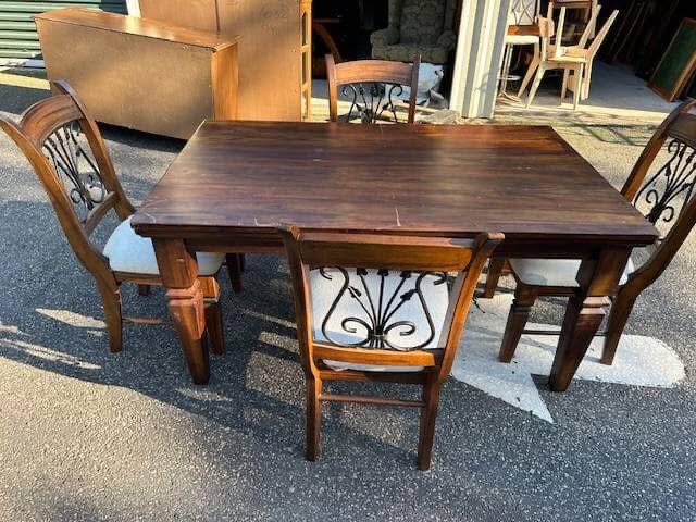Wooden dining table with chairs